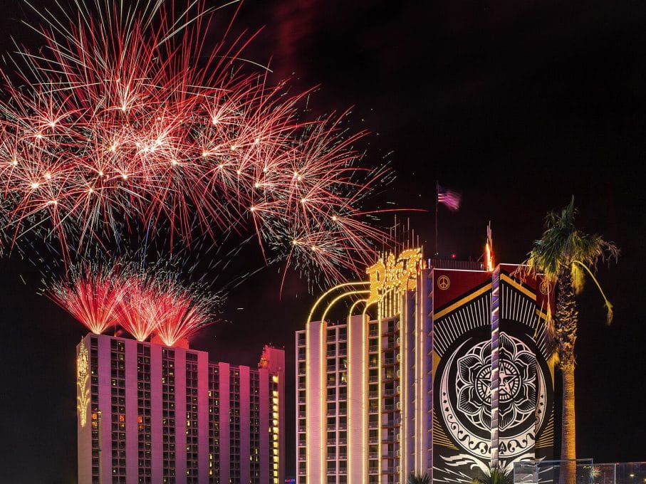 The Plaza Hotel & Casino, Las Vegas, illuminated at night with New Year's fireworks in the sky